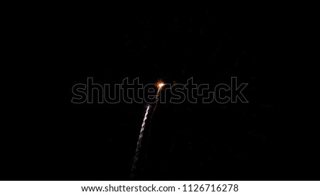 Beautiful fireworks explosion in the night sky like a flying comet