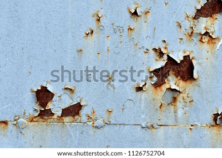 rusty and damaged metal background. painted metall wall with rough rust
