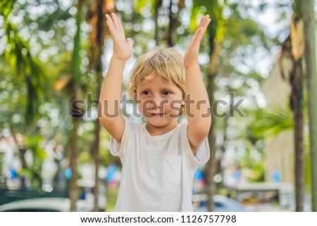 Boy on the background of palm trees.