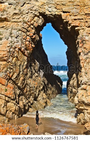 "Arch rock" on Keurbooms beach near Plettenberg bay, South Africa. This is a popular tourist attraction on the Garden route in South Africa. 