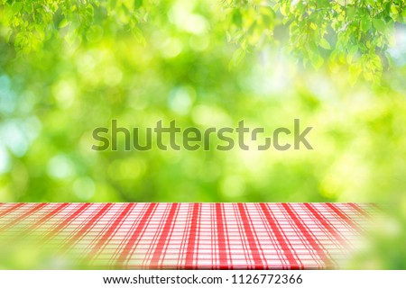 Empty table and picnic on abstract background for Your photomontage or product display.