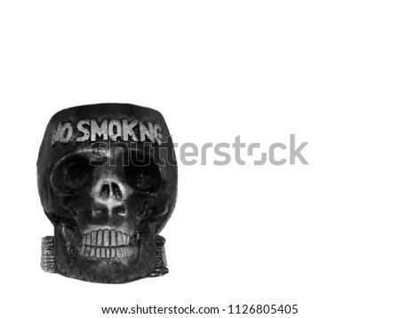 Skull of black color on a white background. Black and white photo. Ashtray in the form of a skull. Black and White Human skull, isolated on white background with clipping path