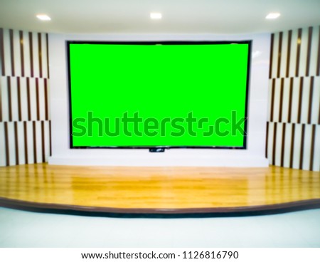Modern empty green television on stage in studio and lighting. Soft and blur focus.