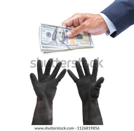 Businessman hand with US. dollar giving to worker hand on white background