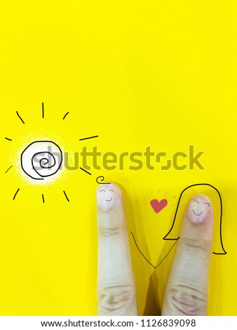 A cute couple fingers face