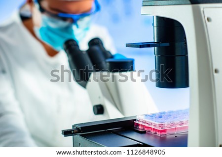  Stem cell researcher working in laboratory Royalty-Free Stock Photo #1126848905