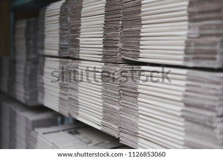 Group of cardboard boxes against boxes on pallet 