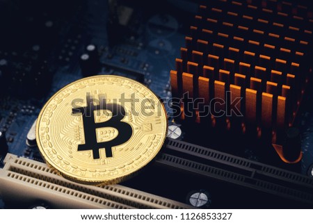 Bitcoin on circuit computer board.Devices and technology for mining new virtual cryptocurrency concept and digital payment system.

