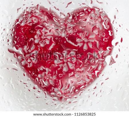 Bright Abstract Red Heart Isolated On White  Background Through The Drops. Macro Photography