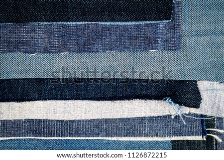 Abstract different torn jeans stripes texture background. Jeans texture. Striped jeans background. Denim jeans texture.
