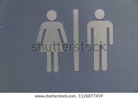 Toilet signs in public area for women and children.