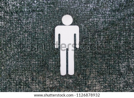 Restroom sign on a toilet door,on green grass background.Toilet sign - Toilet icons set. Men signs for restroom.