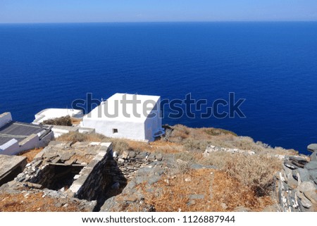 Photo from picturesque and iconic and historic village of Kastro with whitewashed Cycladic houses and breathtaking  views to deep blue Aegean sea, island of Sifnos, Cyclades, Greece