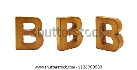Single sawn wooden B letter symbol in different angles and foreshortenings isolated over the white background