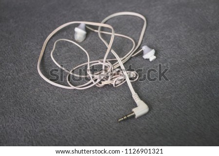 tangled headphones on the background