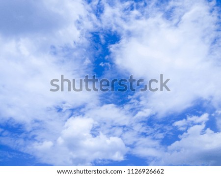 White clouds on a blue sky, abstract background, pattern with clouds, natural white blue texture, blank for a designer, art