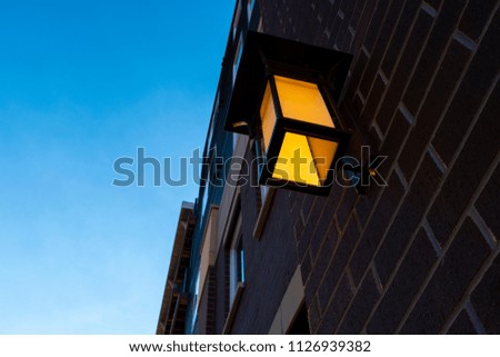 Glowing Yellow Light On A Brick Wall