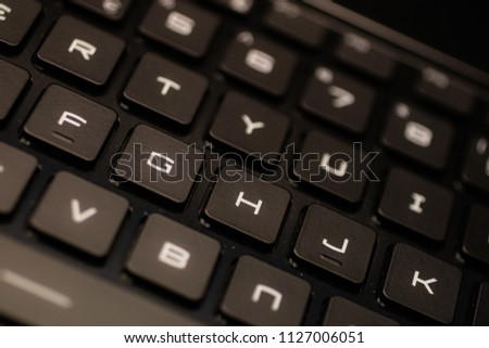 Close up of the keys on a sleek QWERTY keyboard