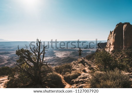 	
young man with Magnificent view of Canyonlands, Utah, USA