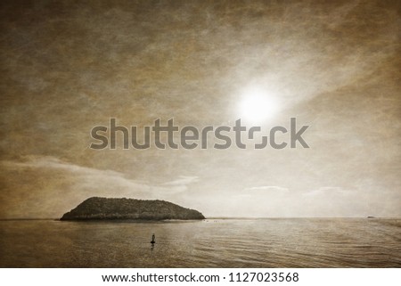 Black and white two tone and add texture for old photos vintage style, nature landscape of sun in the sky above the Koh Tae Nai small island near Ko Pha Ngan in Surat Thani province, Thailand