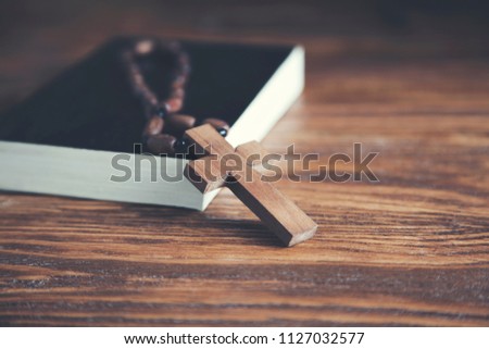 Bible and cross in religious concept