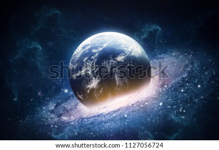 Abstract space collage with Earth planet and spiral galaxy collision. Explosion of universe. Elements of this image furnished by NASA Royalty-Free Stock Photo #1127056724