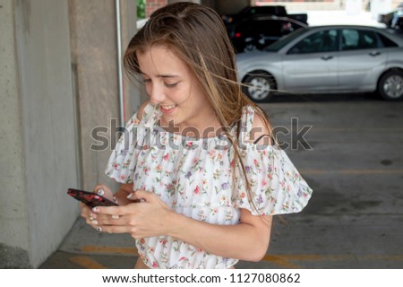 Teenage Girl on Her Cell Phone