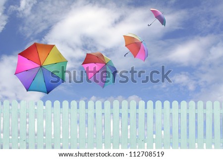 colorful umbrellas flying in a rich blue sky.conceptual image.