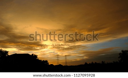 Golden sunset with beautiful clouds.