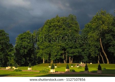 Ancient European Park before the storm. Dark storm sky