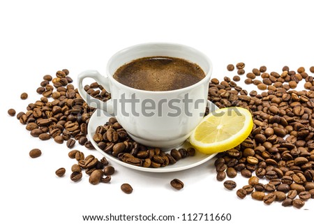 Cup of coffee with lemon and grains isolated on white Royalty-Free Stock Photo #112711660