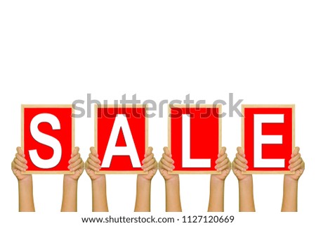 Word 'sale' in red board with hands hold up isolated white background.