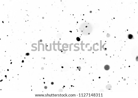black bokeh on a white background blurry