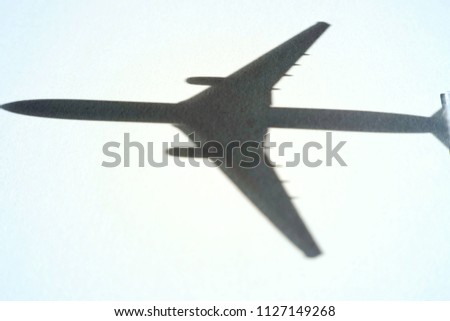 A picture of aeroplane shadow as a symbol for MH370 the lost flight at Kuala Lumpur International Airport.
