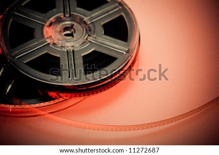 Red and black film reel concept background. Focus on film. Movie industry.