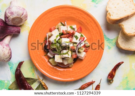 Greek salad with feta cheese cubes and fresk vegetables