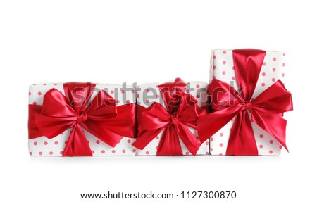 Beautifully wrapped gift boxes on white background