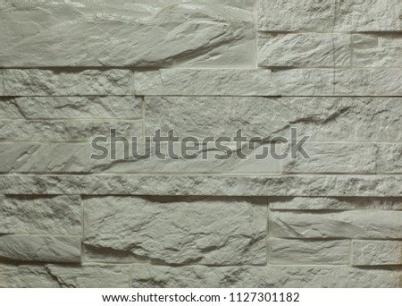 tile, gray wall from blocks of decorative stone