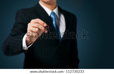 Businessman writing, drawing on the screen Royalty-Free Stock Photo #112730233