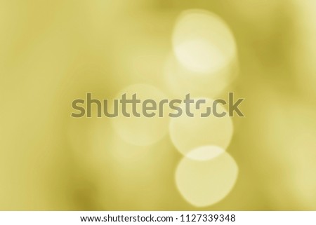 Abstract lighting background with large coloured out of focus bohek lights on black.