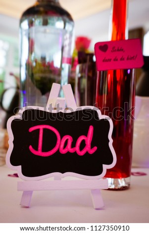 The place card for the name DAD, dad his place
