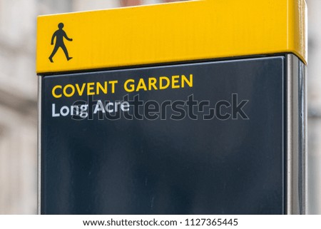 A street sign in central London directs pedestrians towards Covent Garden and Long Acre
