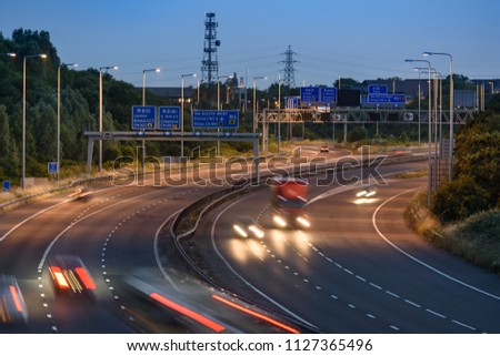 Traffic light trails of fast moving vehicles travelling along the M5 motorway near Bristol, England