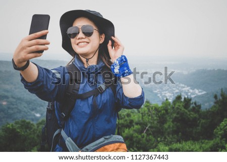 A young and happy hiker in the tropical Asian forest