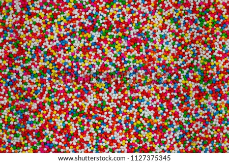 colorful sweet circle shape . sugar yummy balls candy background . small piece Royalty-Free Stock Photo #1127375345