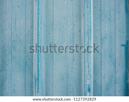 Blue cheap zinc fence background.