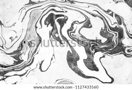 Suminagashi – the ancient art of Japanese marbling. Paper marbling is a method of aqueous surface design, which can produce patterns similar to smooth marble or other kinds of stone. Natural luxury. Royalty-Free Stock Photo #1127433560