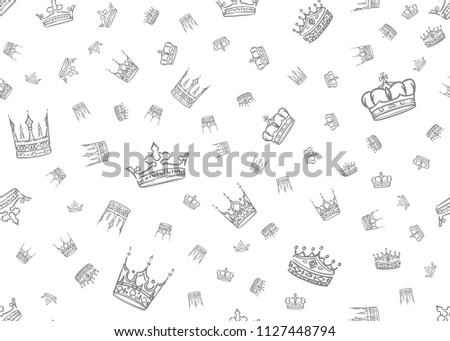 Doodle crown seamless pattern. Scattered hand drawn crowns on white background. Vector illustration for print, textile, paper.