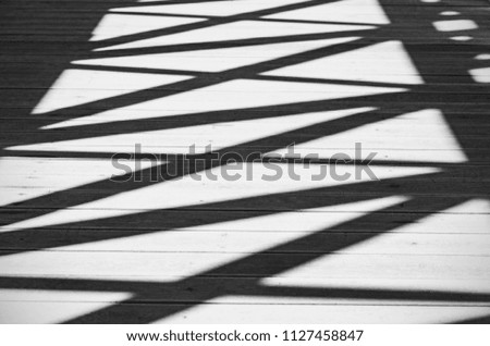 Abstract Shadows of Lines and Figures on a Road as Background or Texture, Black and White Picture