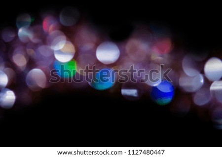   Multicolored defocused bokeh lights.  City winter night street blurred defocused background. Night winter blurred background.